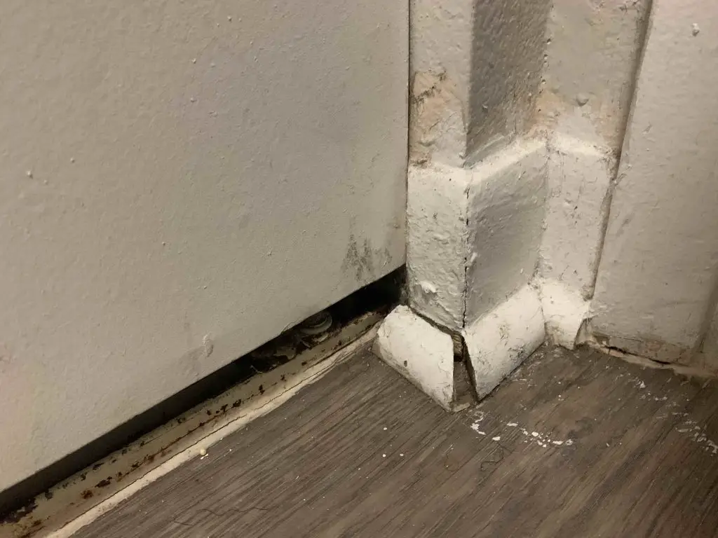 unsealed hole in baseboard wall