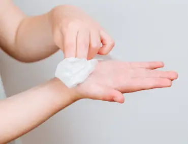 cleaning hand with wipes